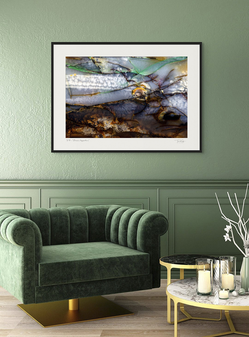 Tamra Gentry Fine Art Photography Green sofa chair in room with green wall with abstract photograph hanging on the wall.